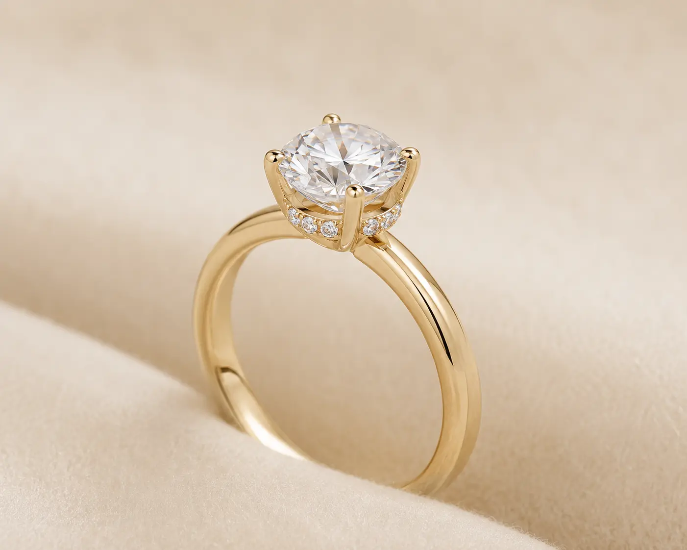 Hidden halo diamond engagement ring shown from an angled profile